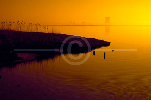 HD_SL-28 - Sunrise photo taken from across the Delaware River below New Castle, DE of the Salem Nuclear Power Station through the early morning mist.