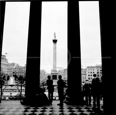 HD_P-38 - People at entrance to National Gallery in London stare out at Trafalgar Square.