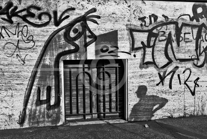 HD_STBW-22 - Grafitti on a wall in Rome north of St. Peter's. Shadow of person on lower left-side.