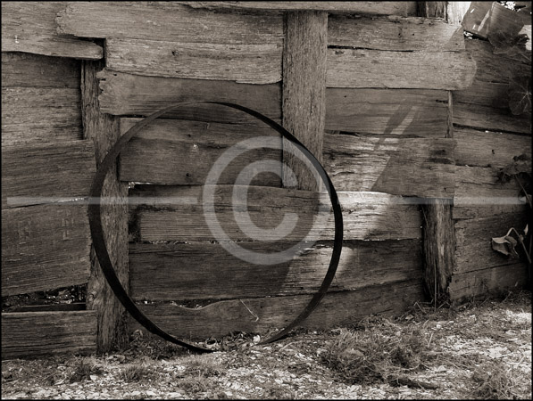 HD_STBW-95 - Metal Barrel Rim-Old Wood Fence - Carters Grove Plantation near Williamsburg, Virginia.