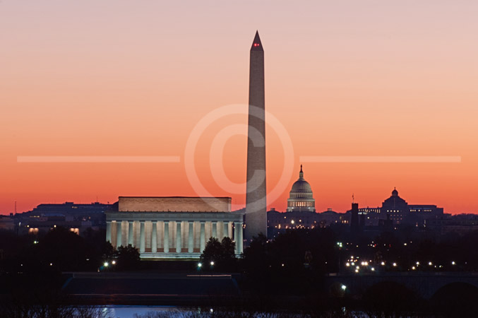 HD_STC-61 - Photo taken from Arlington Virginia side of Potomac River showing Lincoln Memorial, Washington Monument and U.S. Capitol Building just at dawn.