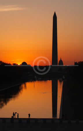 HD_STC-64 - Shot from the top of the Lincoln Memorial, a wedding photographer photographs a couple at sunrise next to the Reflecting Pool on the Mall in Washington, DC. the Washington Monument and Capitol can be seen in the background.